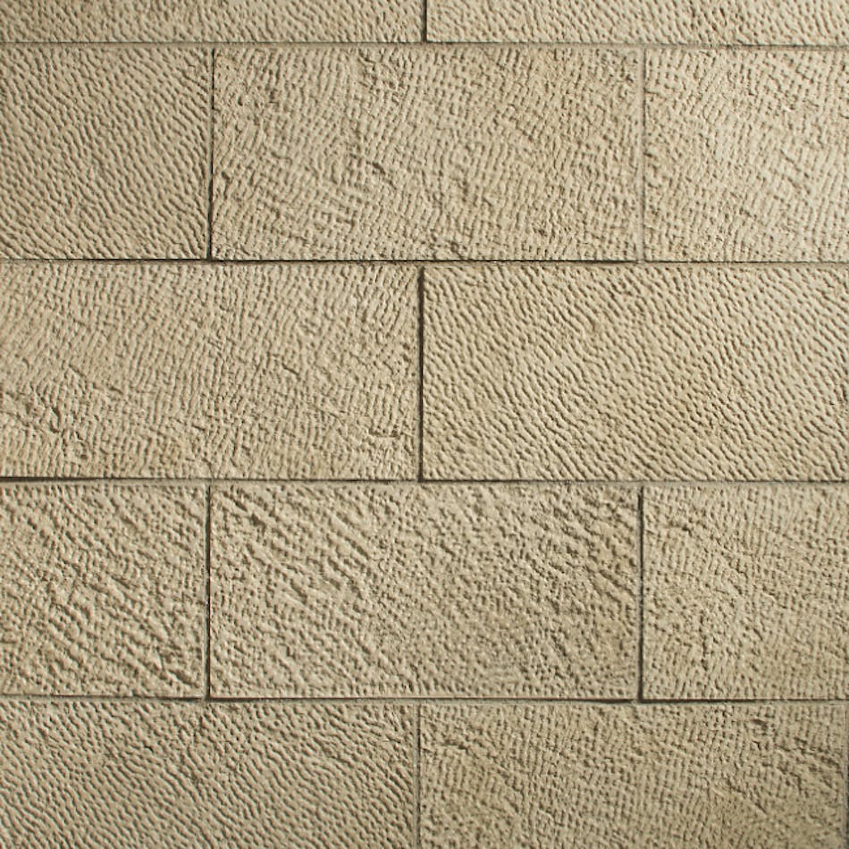 A close-up of textured, rectangular-shaped stone veneer mimicking the look of natural stone in the shade Biscuit.