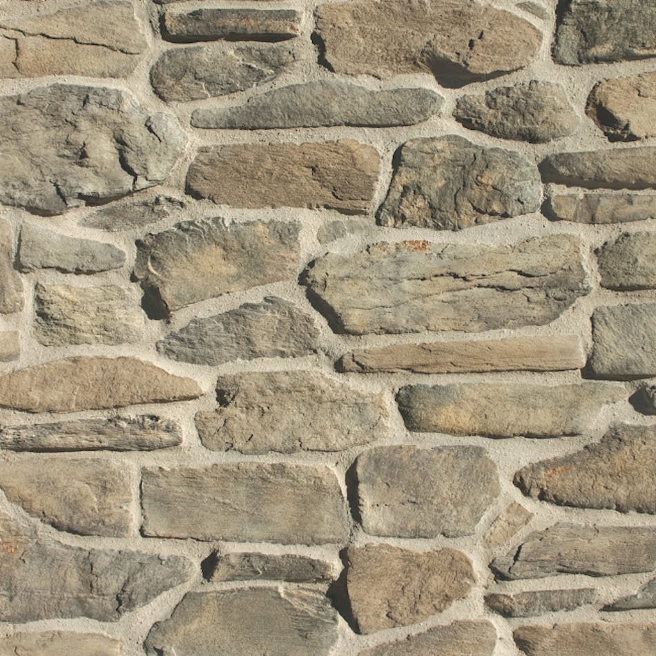 An earthy-colored stone veneer wall mimicking rustic, informal ledge stone in diverse shapes and sizes with weathered, lightly textured faces. Shown here in Greentea.