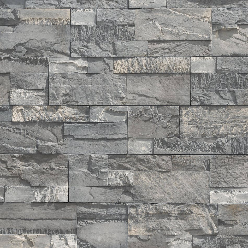 A pre-assembled stone veneer wall in the shade Shadowplay with pronounced sawtooth texture and stones in varying shapes and sizes.