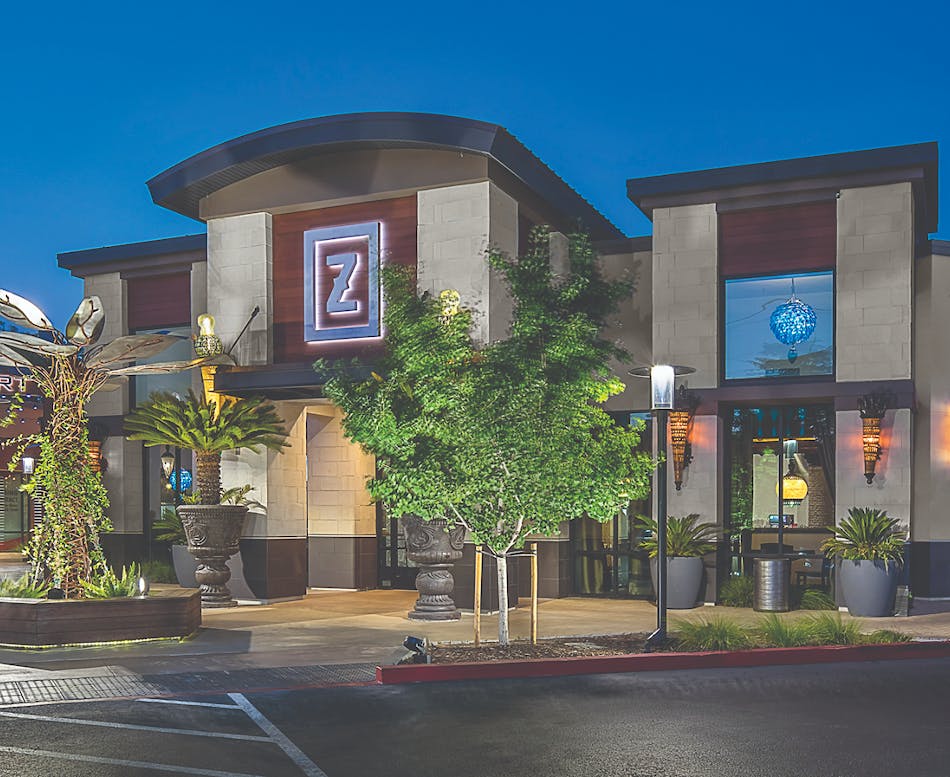 This high-end retail center utilizes a balance of wood, stucco and rectangular cut chiseled limestone to create a strong focal point and grand entrance to the various shops.