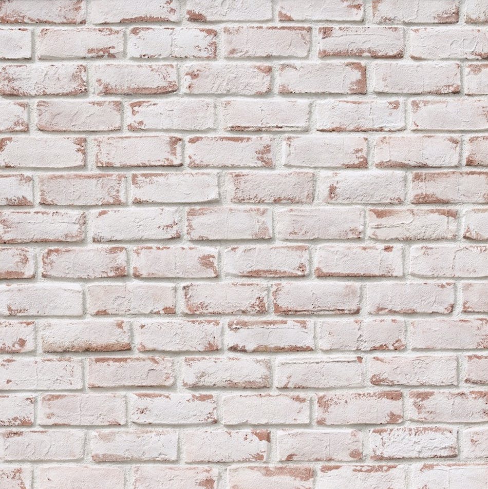 Wall of brick veneer colored white with touches of red.